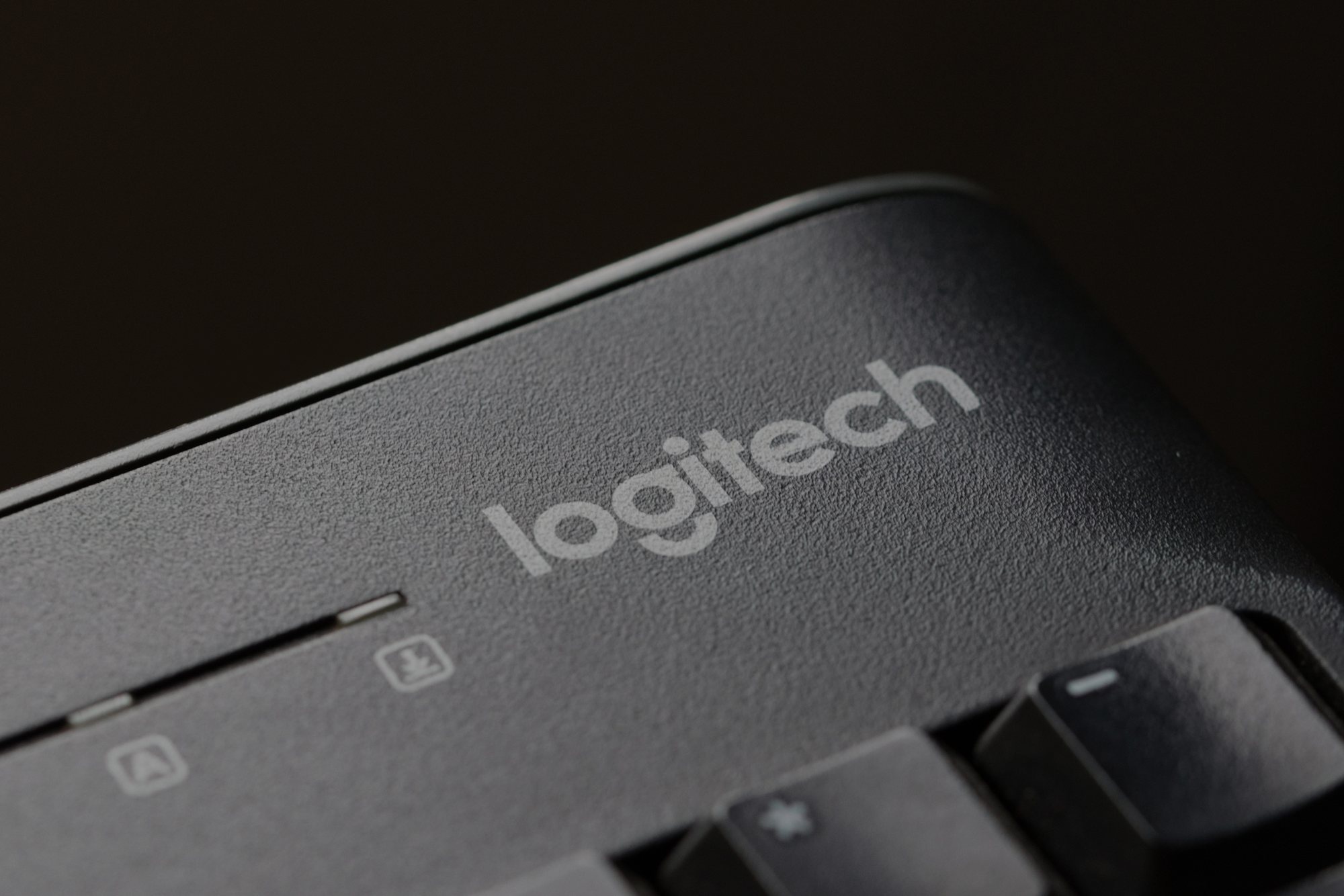Close-up of the Logitech wordmark on a keyboard