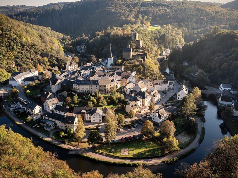 Esch-sur-Sure in Luxembourg, the village wrapped in a bend of the river below its castle ruins
