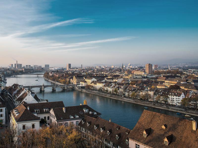 Basel from above in autumn, the Rhine curving past the old town rooftops and its bridges