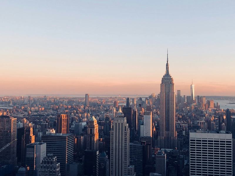 Manhattan at sunrise, the Empire State Building and One World Trade above midtown